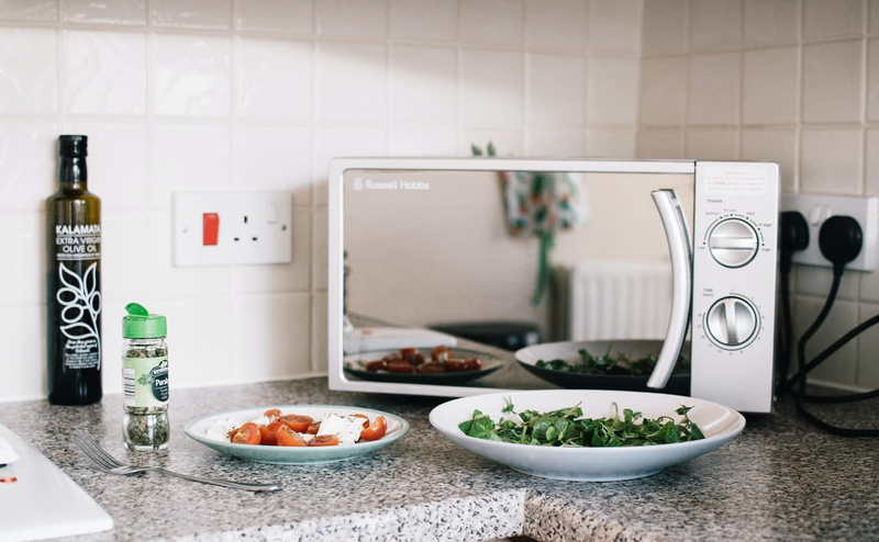 Microwave with food in front of it - Photo by Lisa Fotios from Pexels